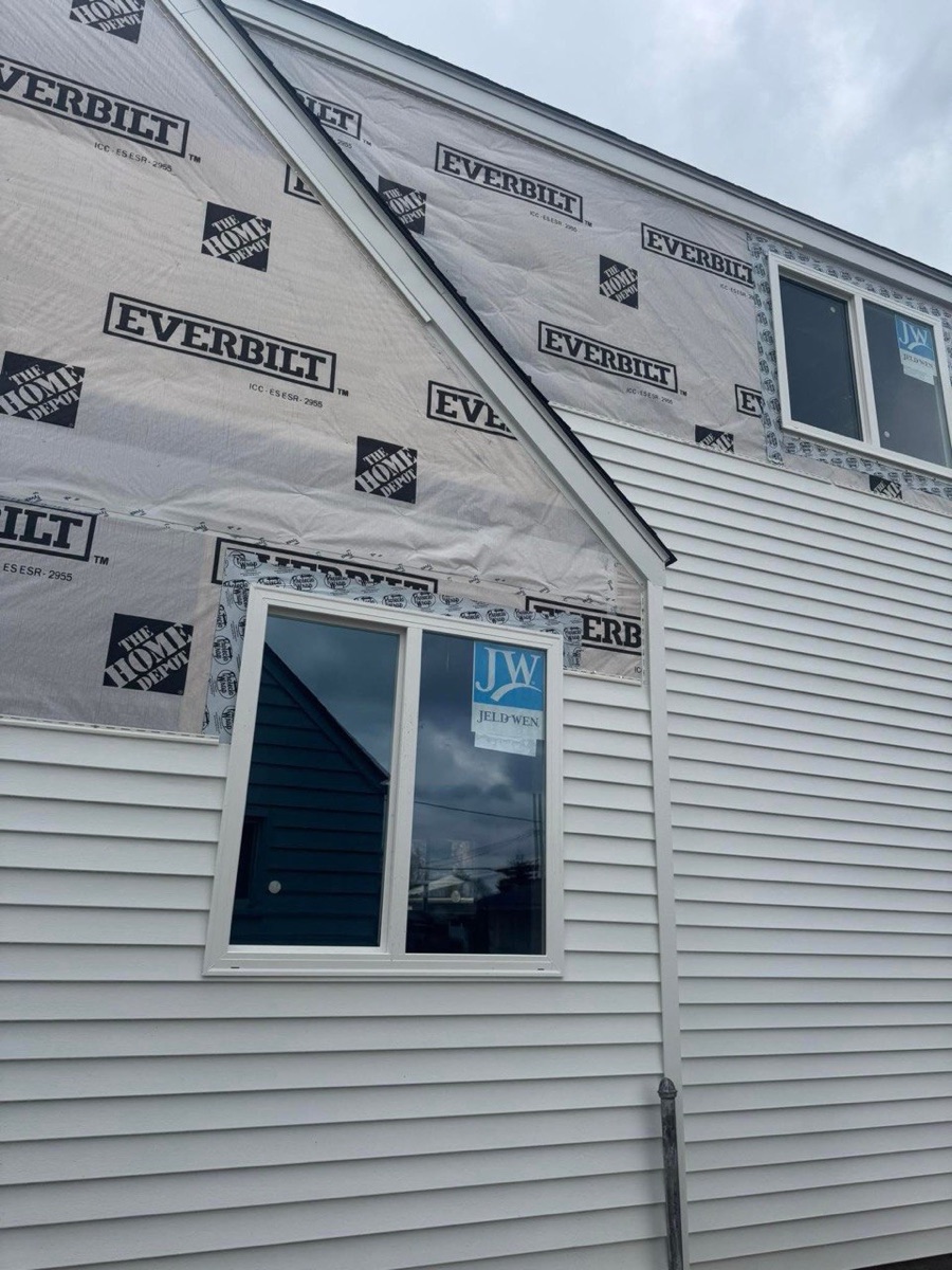 Phase III Construction - siding and window restoration